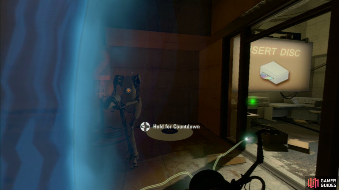 Player 1: Once you&rsquo;re successful, the door to your right will briefly open, so quickly set a portal on the wall in there and then on the wall near the switch. Step through, grab the CD from the desk and insert it to &lsquo;complete&rsquo; the test.