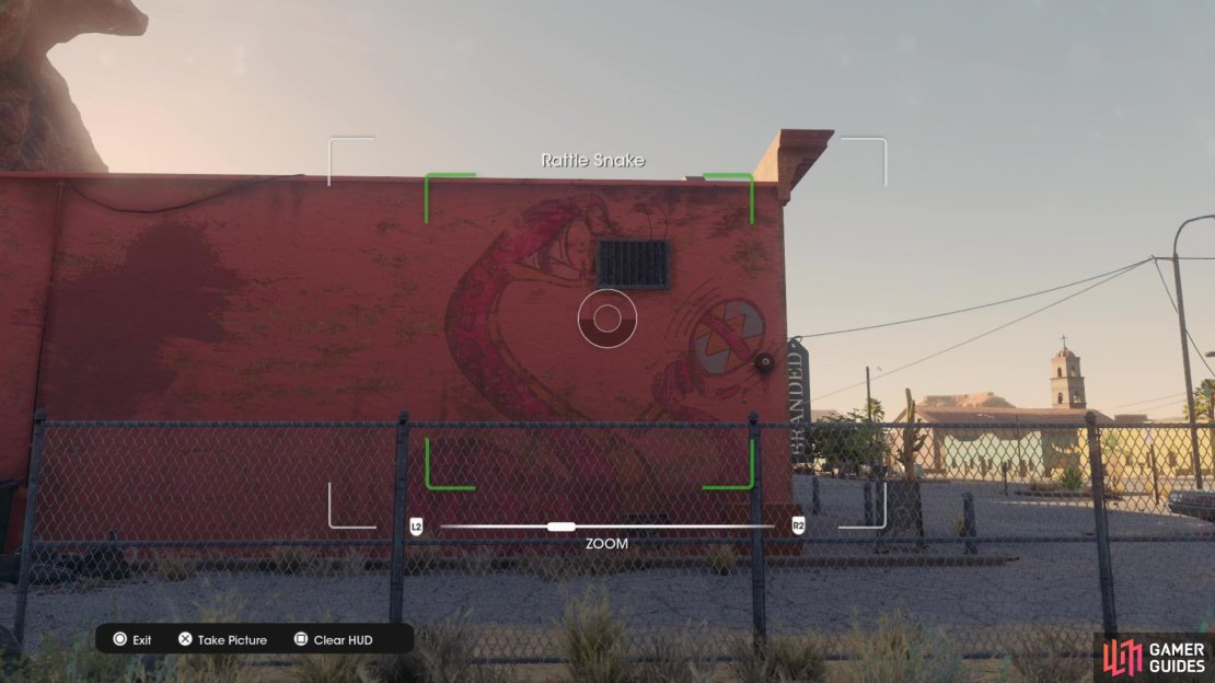 Take a photo of the Rattle Snake graffiti painted on the side of a building near the &ldquo;Branded&rdquo; store.