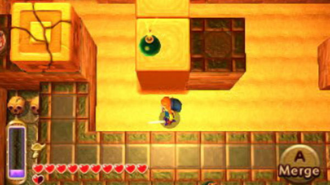 Strike (or lay) a bomb down at the base of the pillar with the cracked sand cube. Raise it up with your Sand Rod so it explodes at the top, taking out the cube.