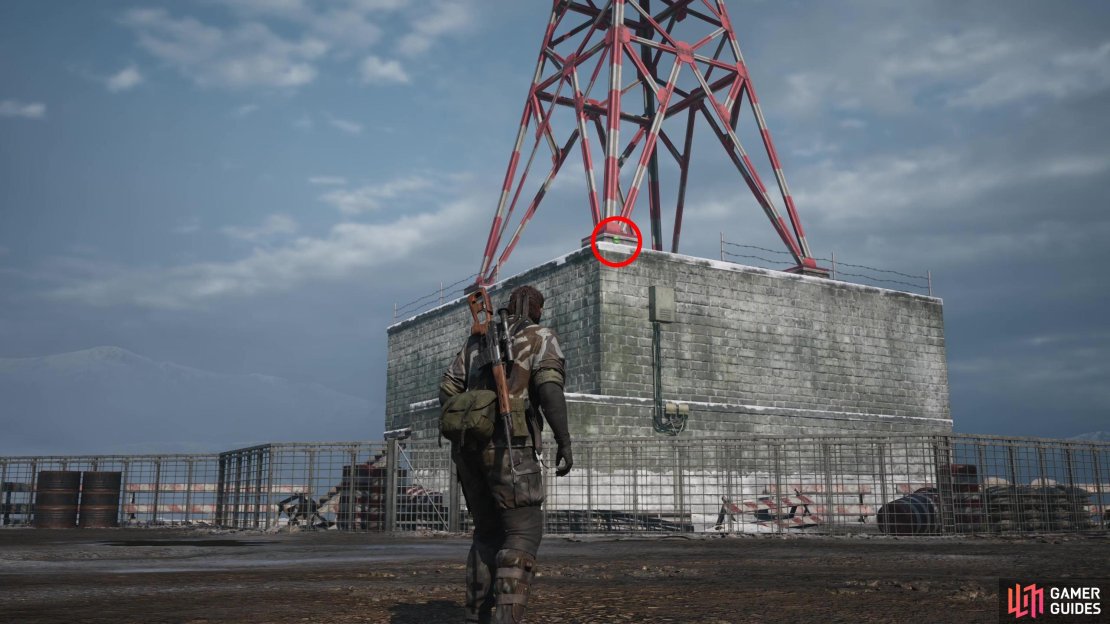 During the second phase of the Shagohod fight, when Snake is on foot. Look northwest to spot a red and white tower. This Kerotan is on the concrete foundation, near the nearest foot of the tower.