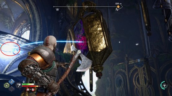 Pull the chain to the right, and quickly throw your axe to break the crystal
