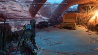 After defeating the enemies in the camp, climb/grapple all the ledges until you reach the back of the camp.