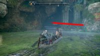 To reach the Veiled Passage, you’ll need to go through the dark cave in the image.