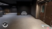 Imogen can be found behind the brown door at the back of the large open room.