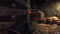 Follow the path while disarming the explosive, then climb the ladder.