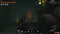 The second chest in the dungeon is located at the end of the walkway on the left side.