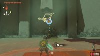 Use Recall on the chest to rescue it out of the sand.