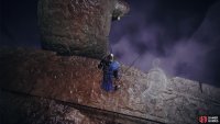 Head to the edge of the large coffin…and jump!