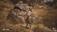 Interact with the boulder to the left and place the Eyes into it.