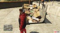 to find this action figure sitting on a pile of trash