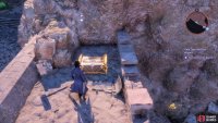 and a small chest hidden behind some crates.