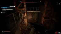 Enter the main building and take the nearby stairs down.