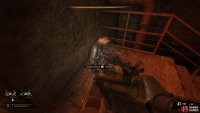 Search the corpse at the top of the stairs at the end of the hall.