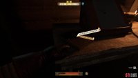 Then go through the first door on the right to find the book on the desk.