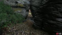 pass through a triangular hole in the rocks ahead,