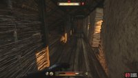 Follow the battlements south and go through the door.