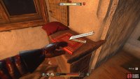 Go up the stairs and into the room to find Rosa’s book, near the window.