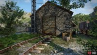Enter the railyard building south of the road,