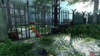 You can find a gap in the fence on the left.