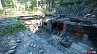 You’ll reach what looks like an abandoned quarry. Use the rubble to reach the door at the bottom.