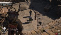 When you reach the building that Merchant Tamao is hiding at, you’ll see a group of people talking about him.
