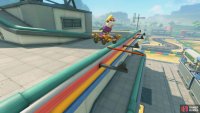 Perform a trick on the raised part of the rail to reach the one above.