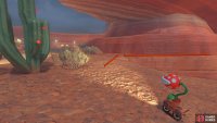 At the top of the slope, drive onto the small ledge to the right of the cactus.
