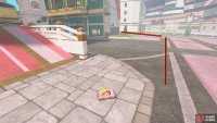 Follow the pink road around the corner to the left.