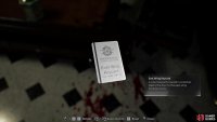 Grab the East Wing Keycard from the severed arm. Image via Gamer Guides / Capcom.