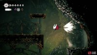 You can exit the Far Fields secret area by unlocking a lever inside, finally lifting that mysterious golden door to the right of Pilgrim&rsquo;s Rest. Image via Gamer Guides / Team Cherry